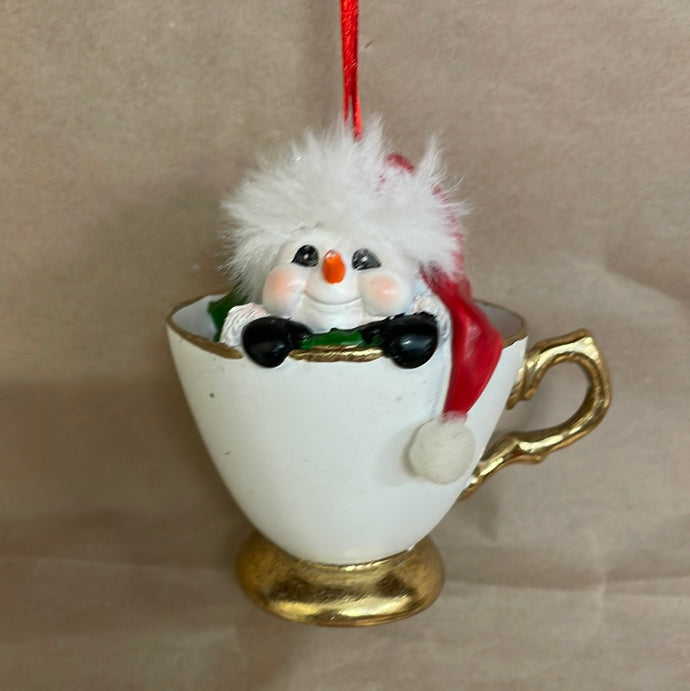 Snowman in a tea cup