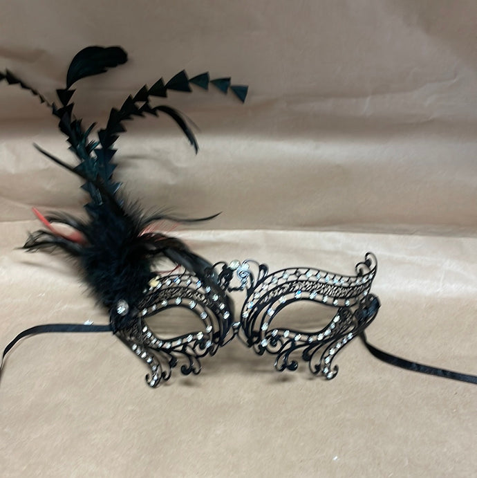 Mask with feathers ornament