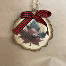 Load image into Gallery viewer, Wood slice with Canada ornament

