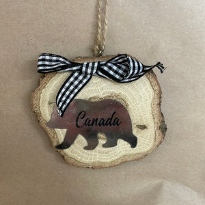 Wood slice with Canada ornament